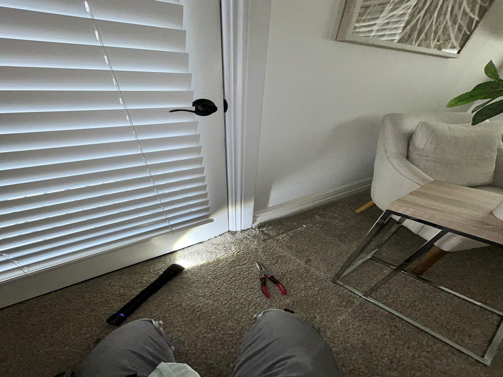 Mold inspection in Coto de Caza bedroom with carpet pulled back near baseboard.