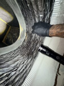 Technician Conducting A Close Inspection Of Hvac Ductwork, Identifying Mold Growth During An Indoor Air Quality And Surface Contamination Test