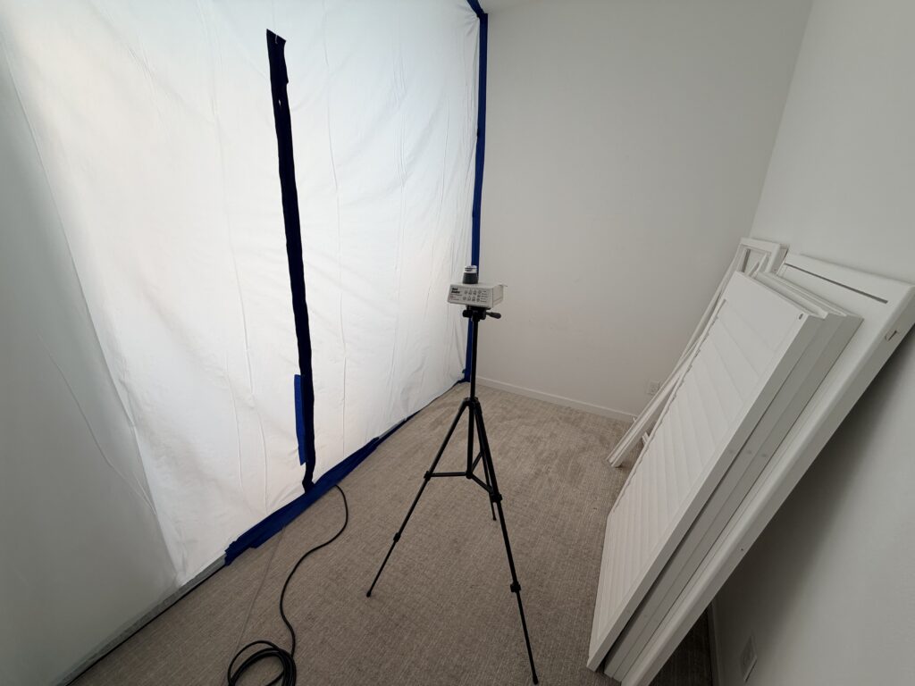 Mold Clearance Inspection Equipment In Brea, Set Up In A Previously Affected Area With Taped Plastic Sheeting To Isolate The Testing Zone