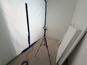 Mold Clearance Inspection Equipment In Brea, Set Up In A Previously Affected Area With Taped Plastic Sheeting To Isolate The Testing Zone