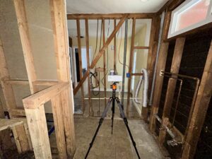 Post-Remediation Clearance Inspection Setup In Brea, Showing A Mold Testing Device Placed Near Exposed Wooden Framing To Check For Moisture And Fungal Growth