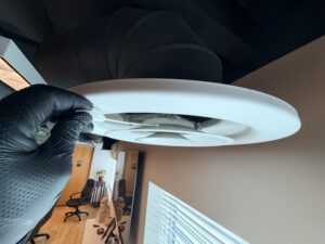 Technician Performing An Air Quality Test In The Office'S Hvac Ducting System To Detect Possible Mold Contamination At An Irvine Commercial Property