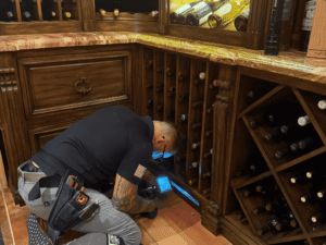 Inspecting Moisture In Cabinet