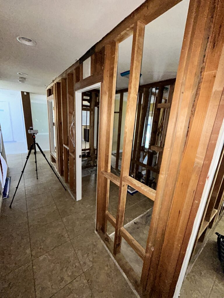 Post-Remediation Clearance Inspection Being Performed In A Hallway Of A Brea Home, Ensuring All Surfaces Are Free From Hidden Mold And Moisture